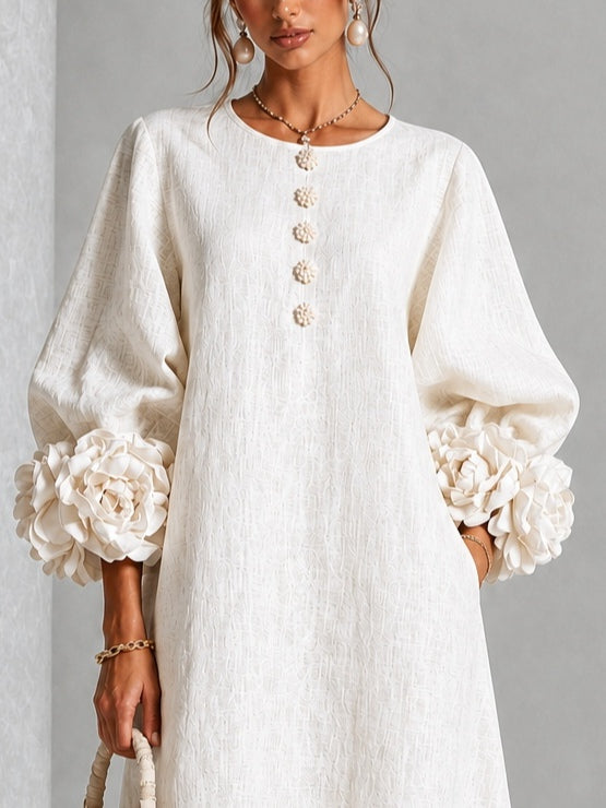 Liana dress in ivory, close view of the rosette cuff